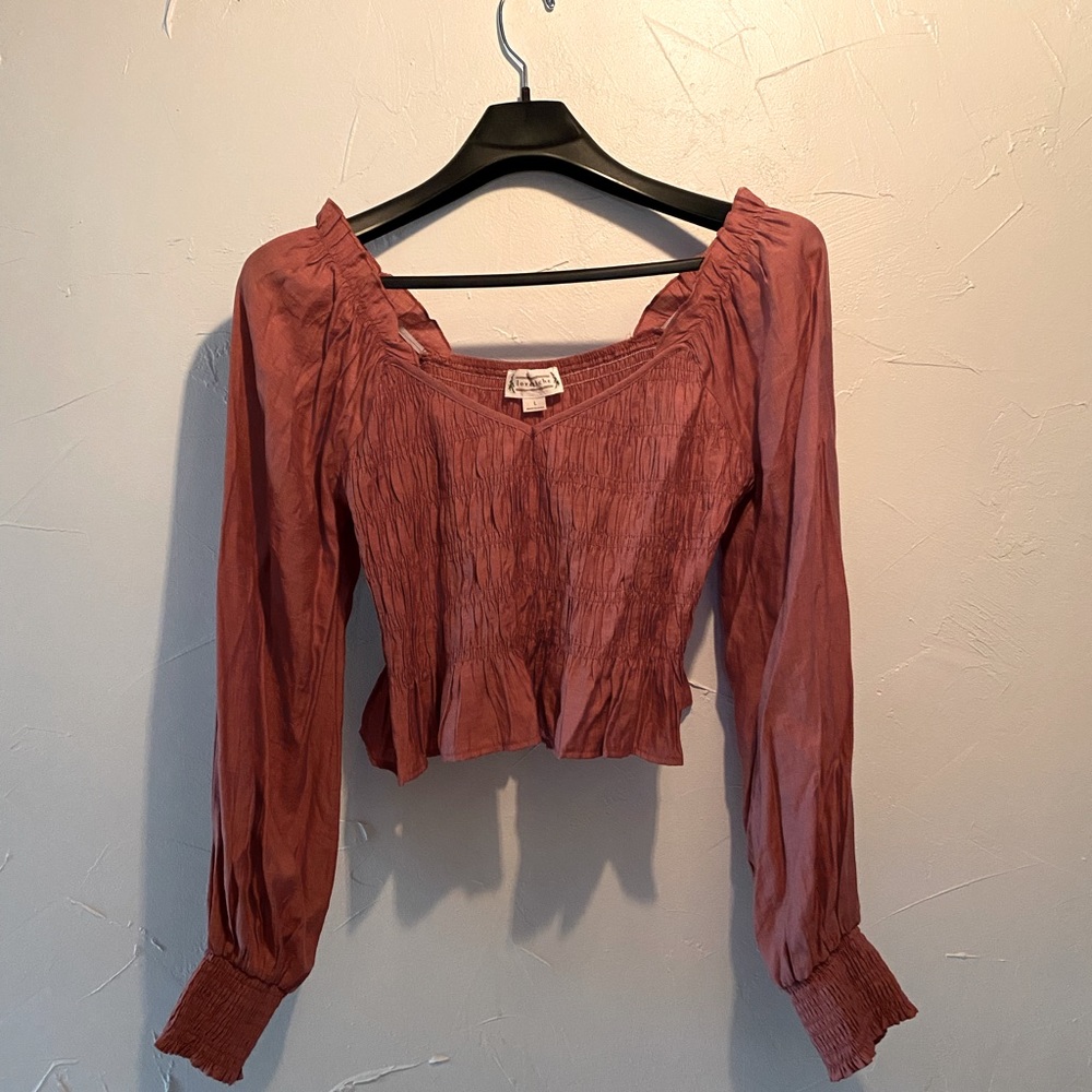 Peach colored off the shoulder long sleeve blouse